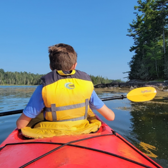 a person rowing a boat in a body of water